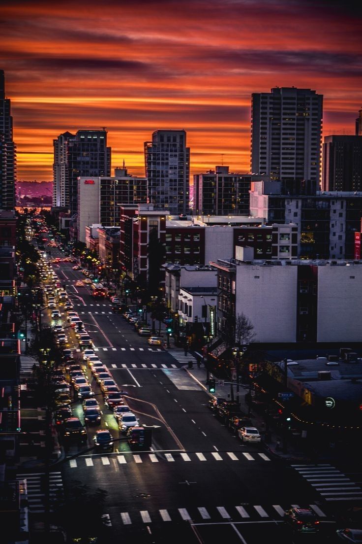 Downtown City Street Scene with High-Rise Buildings at Sunset
