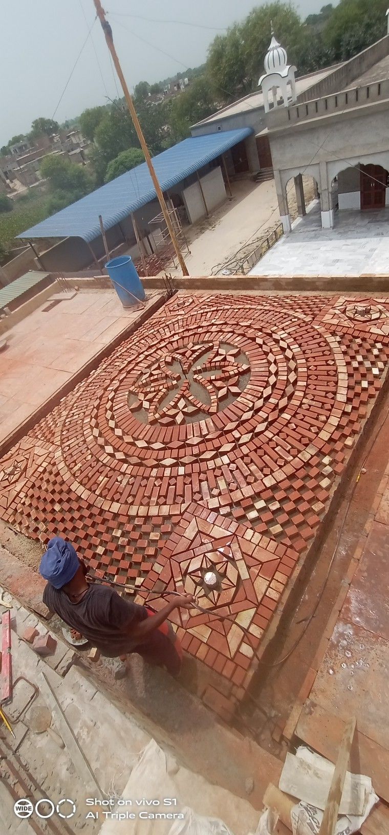 Intricate Brick Mosaic Installation on Rooftop Terrace with Geometric Patterns