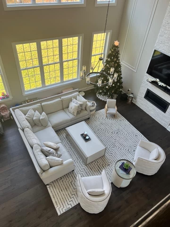 Bright Contemporary Living Room with Large Windows and Holiday Decor